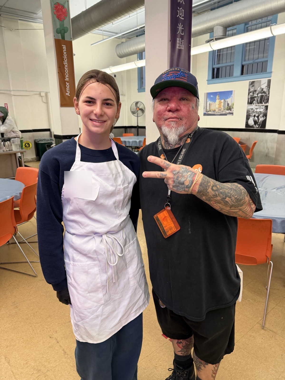 Elia volunteering with a guest at GLIDE in San Francisco